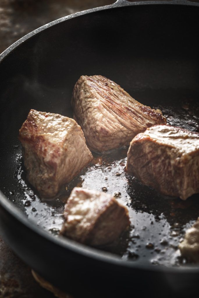 Fried angus beef in the hot pan vertical